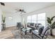 Comfortable living room with large windows offering natural light and wood-look floors at 1729 Elk Dr, Lakeland, FL 33801