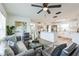 Inviting living room with stylish furniture and wood-look floors, connects to an open-concept kitchen at 1729 Elk Dr, Lakeland, FL 33801