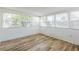 Bright sun room with plenty of windows and new flooring at 1729 Elk Dr, Lakeland, FL 33801