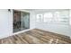 Inviting sun room features bright natural light and wood laminate flooring at 1729 Elk Dr, Lakeland, FL 33801