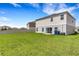 Large backyard with a well-maintained lawn and partial privacy fence at 4381 Pumice Dr, Lakeland, FL 33811