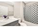 Bathroom showcases stylish vanity, toilet, and a shower-tub combo at 4381 Pumice Dr, Lakeland, FL 33811