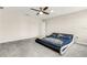 Bedroom featuring a modern platform bed, ceiling fan, and neutral walls at 4381 Pumice Dr, Lakeland, FL 33811