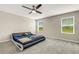 Bedroom featuring a modern bed, ceiling fan, and great natural light from two windows at 4381 Pumice Dr, Lakeland, FL 33811
