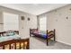 Bedroom features twin beds, two windows, and neutral-toned walls at 4381 Pumice Dr, Lakeland, FL 33811