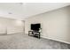 Comfortable bonus room featuring a black TV stand and gray carpet at 4381 Pumice Dr, Lakeland, FL 33811
