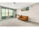 Bright bonus room with large windows, plush gray carpeting and stylish decor at 4381 Pumice Dr, Lakeland, FL 33811
