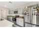 Well-equipped kitchen featuring stainless steel appliances, gray cabinetry, and ample counter space at 4381 Pumice Dr, Lakeland, FL 33811