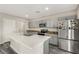 Stylish kitchen with an island, stainless steel appliances, and modern cabinets at 4381 Pumice Dr, Lakeland, FL 33811