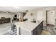 Kitchen island with a sink overlooking the dining area and adjacent living space at 4381 Pumice Dr, Lakeland, FL 33811