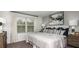 Cozy bedroom featuring a large window, soft bedding, and tasteful artwork at 161 River Front Way, Edgewater, FL 32141