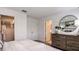 Bright bedroom featuring a large dresser, walk-in closet and neutral decor at 161 River Front Way, Edgewater, FL 32141