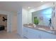 Bright bathroom features double sinks, vanity, and an ensuite bedroom at 2956 Penelope Loop, Kissimmee, FL 34746