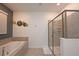 This bathroom has a separate shower and soaking tub at 2956 Penelope Loop, Kissimmee, FL 34746