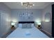 Cozy bedroom with decoratively framed photos and carpet at 2956 Penelope Loop, Kissimmee, FL 34746