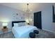 This bedroom has a plush carpet, and a modern chandelier at 2956 Penelope Loop, Kissimmee, FL 34746