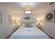 Bright bedroom with white walls, plush bed, and contemporary decor at 2956 Penelope Loop, Kissimmee, FL 34746