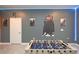 Finished basement game room with foosball table and Harry Potter themed posters at 2956 Penelope Loop, Kissimmee, FL 34746