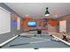 Finished basement game room with pool table, television, and Harry Potter mural at 2956 Penelope Loop, Kissimmee, FL 34746
