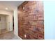 A hallway with a wall design of a shelf full of books at 2956 Penelope Loop, Kissimmee, FL 34746