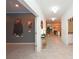 Hallway leading to open living area with recessed lighting and decorative accents at 2956 Penelope Loop, Kissimmee, FL 34746