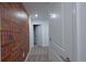 A hallway with a wall design of a shelf full of books at 2956 Penelope Loop, Kissimmee, FL 34746