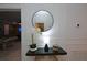 Hallway with decorative table, mirror, leading into game room at 2956 Penelope Loop, Kissimmee, FL 34746