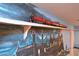 Close-up of the custom castle mural with a miniature train display at 2956 Penelope Loop, Kissimmee, FL 34746