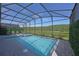 Enjoy a screened in pool and patio with a great view to the greenery and nature at 2956 Penelope Loop, Kissimmee, FL 34746