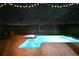 Night time view of private screened-in pool and spa, beautifully lit and ready for relaxation at 2956 Penelope Loop, Kissimmee, FL 34746