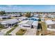 Aerial view of a charming single-story house showcasing its well-manicured front lawn, and an attached garage at 5006 Lodgewood Dr, Lakeland, FL 33810