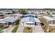 Aerial view of a charming single-story house showcasing its well-manicured front lawn, and an attached garage at 5006 Lodgewood Dr, Lakeland, FL 33810