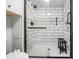 Bathroom boasts a glass enclosed shower with black trim, a built in niche and black hardware at 5006 Lodgewood Dr, Lakeland, FL 33810