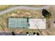 Aerial view of the community with a tennis court and a basketball court at 5006 Lodgewood Dr, Lakeland, FL 33810