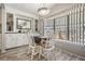 Bright dining area featuring a charming table setting, natural light, and neutral decor at 5006 Lodgewood Dr, Lakeland, FL 33810