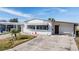 Charming home features a well-kept lawn, a driveway, and an attached garage for parking and convenience at 5006 Lodgewood Dr, Lakeland, FL 33810