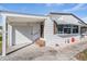Charming single-story home featuring a well-maintained yard and a cozy covered entrance at 5006 Lodgewood Dr, Lakeland, FL 33810