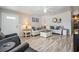 Cozy living room featuring comfortable sofas, modern decor, and a welcoming atmosphere at 5006 Lodgewood Dr, Lakeland, FL 33810