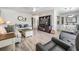 Spacious living room featuring stylish flooring, comfortable seating, and a modern entertainment center at 5006 Lodgewood Dr, Lakeland, FL 33810