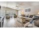Bright living room featuring wood floors, comfortable sofas, and lots of natural light at 5006 Lodgewood Dr, Lakeland, FL 33810