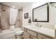 Bathroom featuring a shower/tub combo, a white vanity, and updated fixtures at 6922 Wendy Way, The Villages, FL 34762
