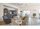 Bright living space featuring cozy armchairs, neutral-toned sectional, a TV, and an open floor plan at 6922 Wendy Way, The Villages, FL 34762