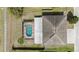 An aerial view shows the full property, including the pool and covered patio at 6087 Sunset Vista Dr, Lakeland, FL 33812