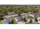 An aerial view of the neighborhood shows a well-maintained street and homes with mature trees at 6087 Sunset Vista Dr, Lakeland, FL 33812