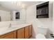 Bathroom with a sink, vanity, medicine cabinet and toilet for convenience and practicality at 6087 Sunset Vista Dr, Lakeland, FL 33812