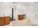 Primary bathroom with double vanity, soaking tub, tiled floors, and great lighting at 6087 Sunset Vista Dr, Lakeland, FL 33812