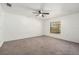 Bedroom with plush carpeting, ceiling fan, and a window to add natural light at 6087 Sunset Vista Dr, Lakeland, FL 33812