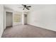 Bedroom featuring two closets, a window, neutral colored walls and carpet at 6087 Sunset Vista Dr, Lakeland, FL 33812