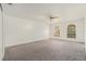 Generous bedroom features plush carpet, abundant natural light, and a ceiling fan at 6087 Sunset Vista Dr, Lakeland, FL 33812