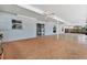 Long covered patio includes a ceiling fan, windows and lots of open space at 6087 Sunset Vista Dr, Lakeland, FL 33812